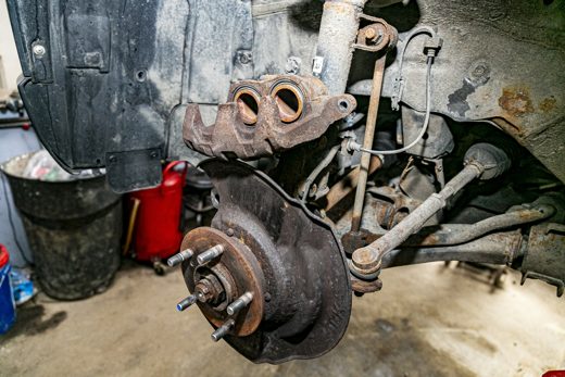 Road-salt corrosion on a vehicle's brake and suspension underside