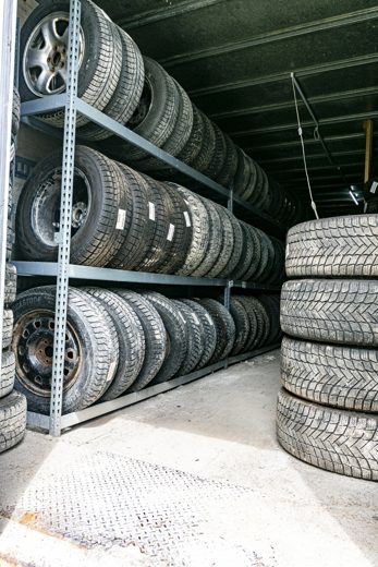 Racks of stored winter tires at Auto Solve ready for the cold season