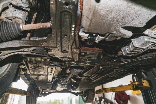 Fully coated vehicle undercarriage after rustproofing