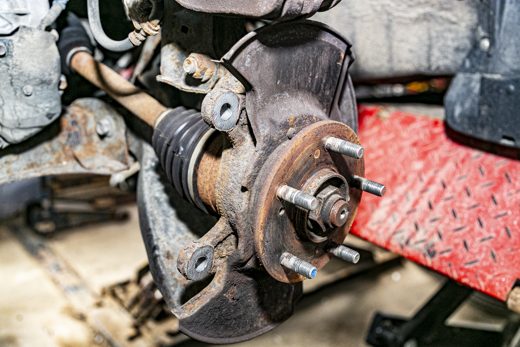 Front wheel hub with the wheel removed, exposing the bearing that causes humming