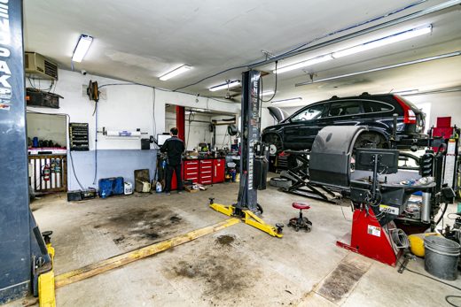 A vehicle up on the lift in Auto Solve's full-service bay in Creemore