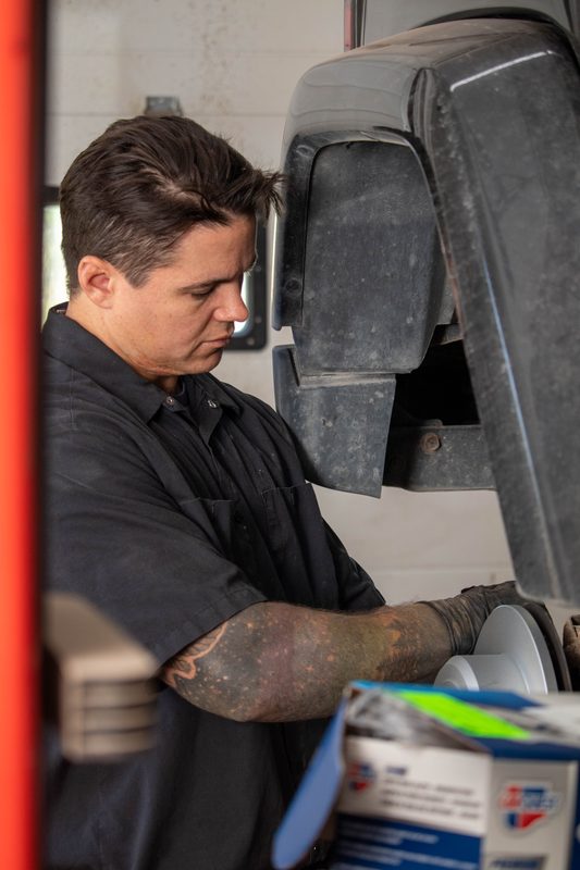 Mechanic performing precise brake rotor work