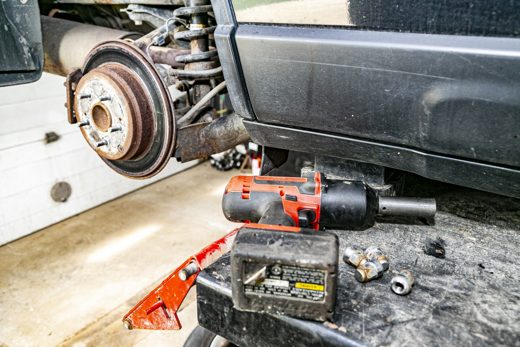 Brake assembly exposed with the wheel off, showing exactly what's worn