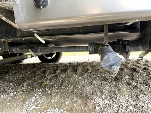 RV sewer drain outlet and plumbing under the belly