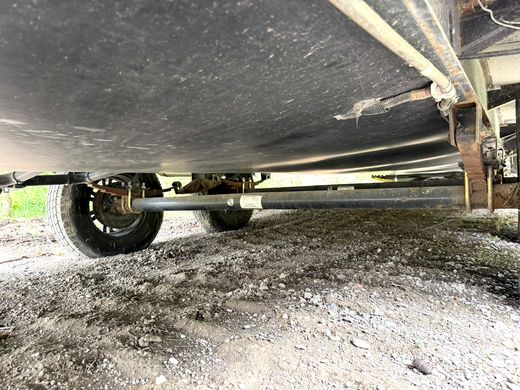 A torn section of the RV underbelly wrap