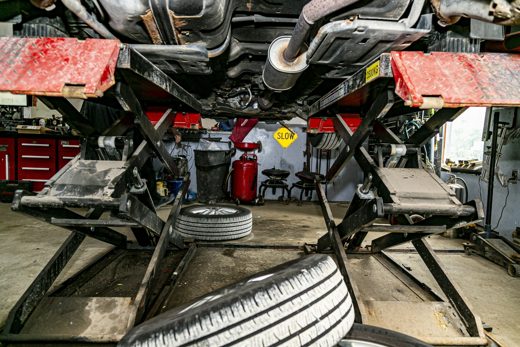 Vehicle raised on the lift for a full underbody inspection at Auto Solve